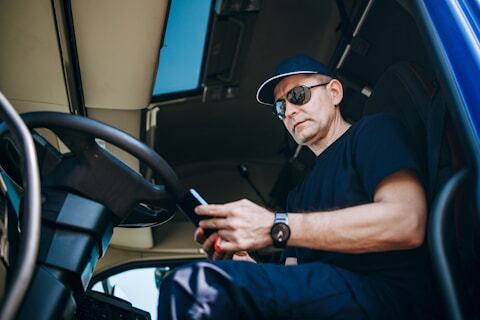 Driver using a tablet inside a truck